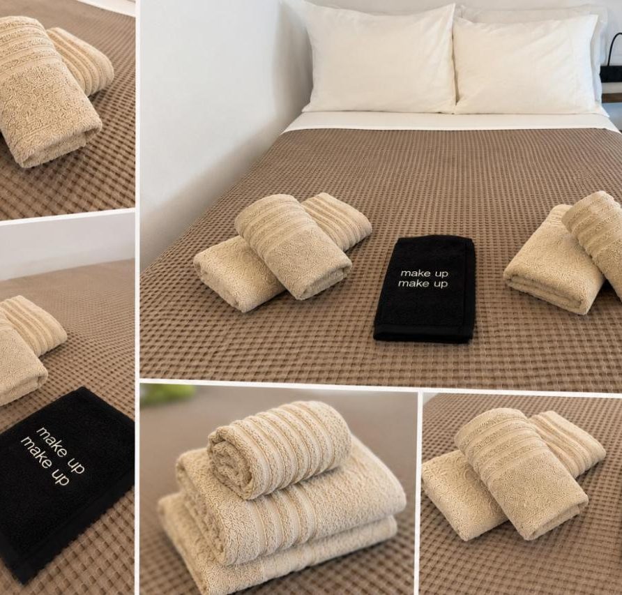 Fresh towels folded on the double bed