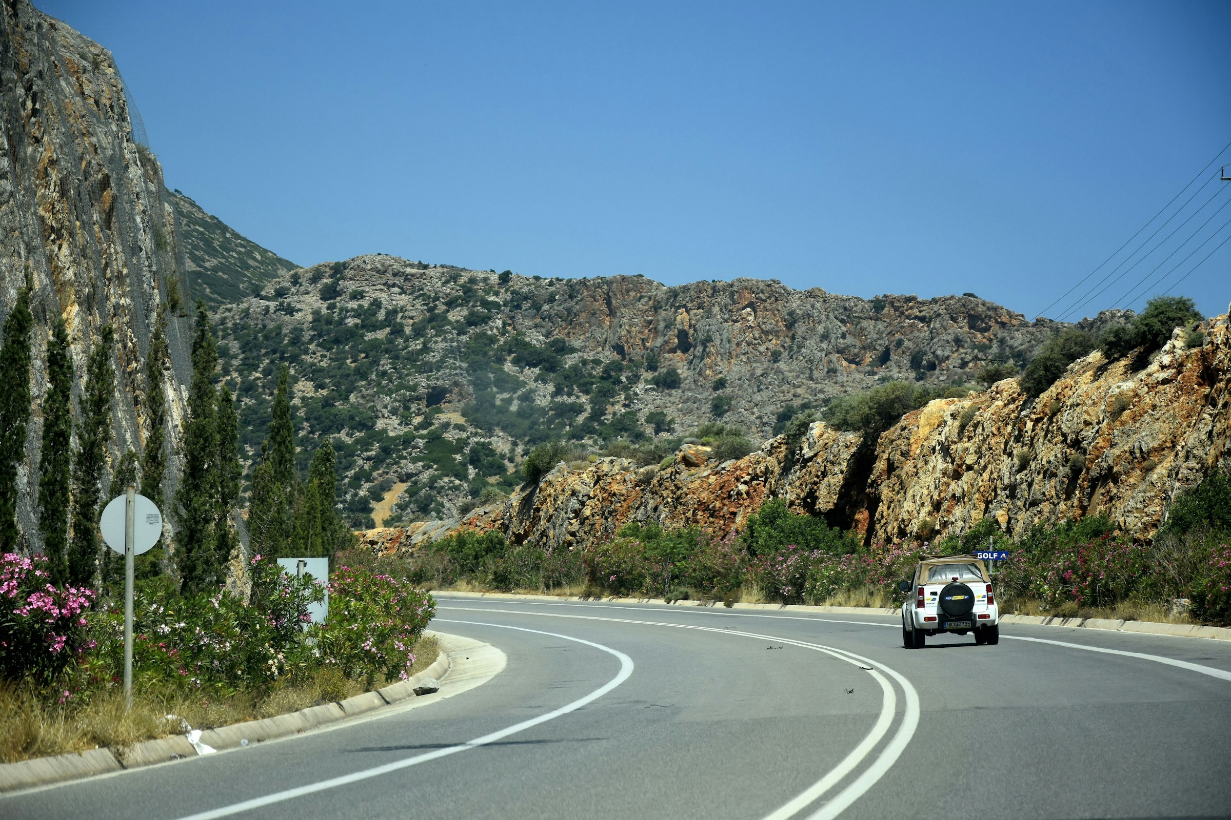 A small car on a winding island road