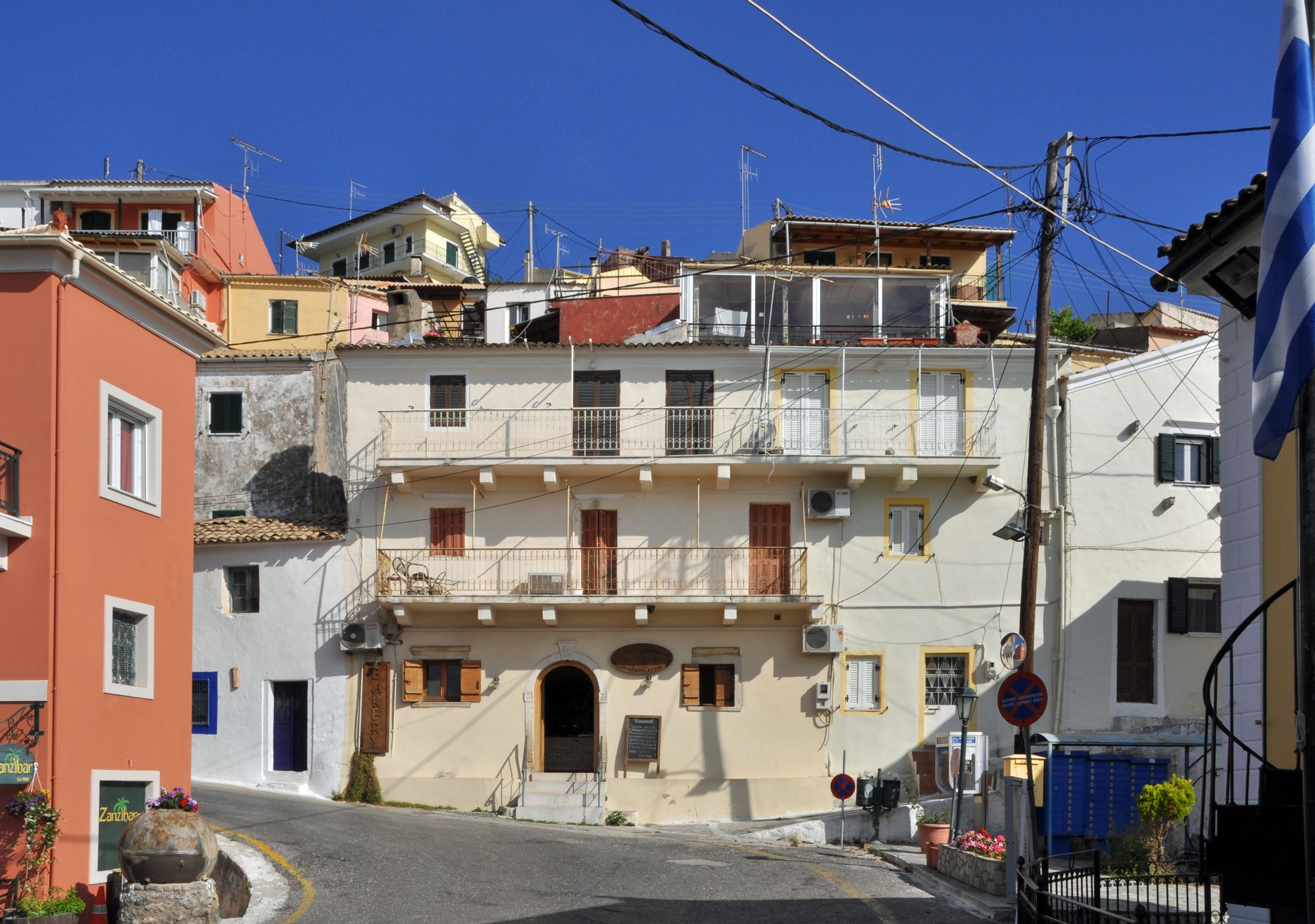 Colourful houses on a street in Pelekas village, Corfu