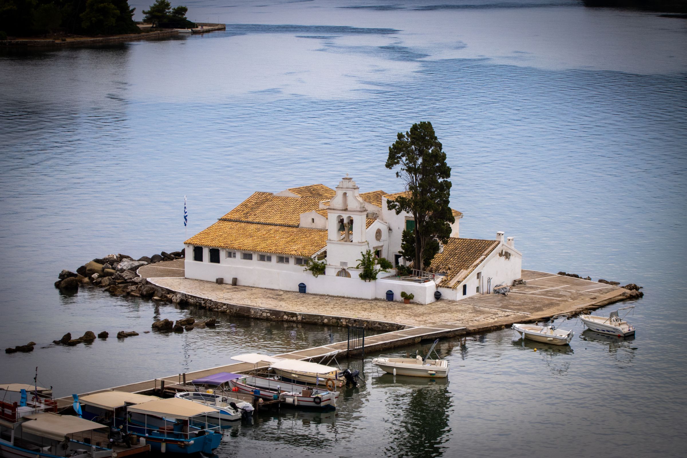 Aerial view of Vlacherna Monastery and the causeway at Kanoni, Corfu